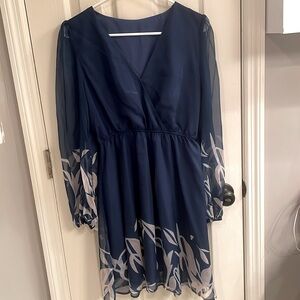 Blue long sleeved dress with light trim